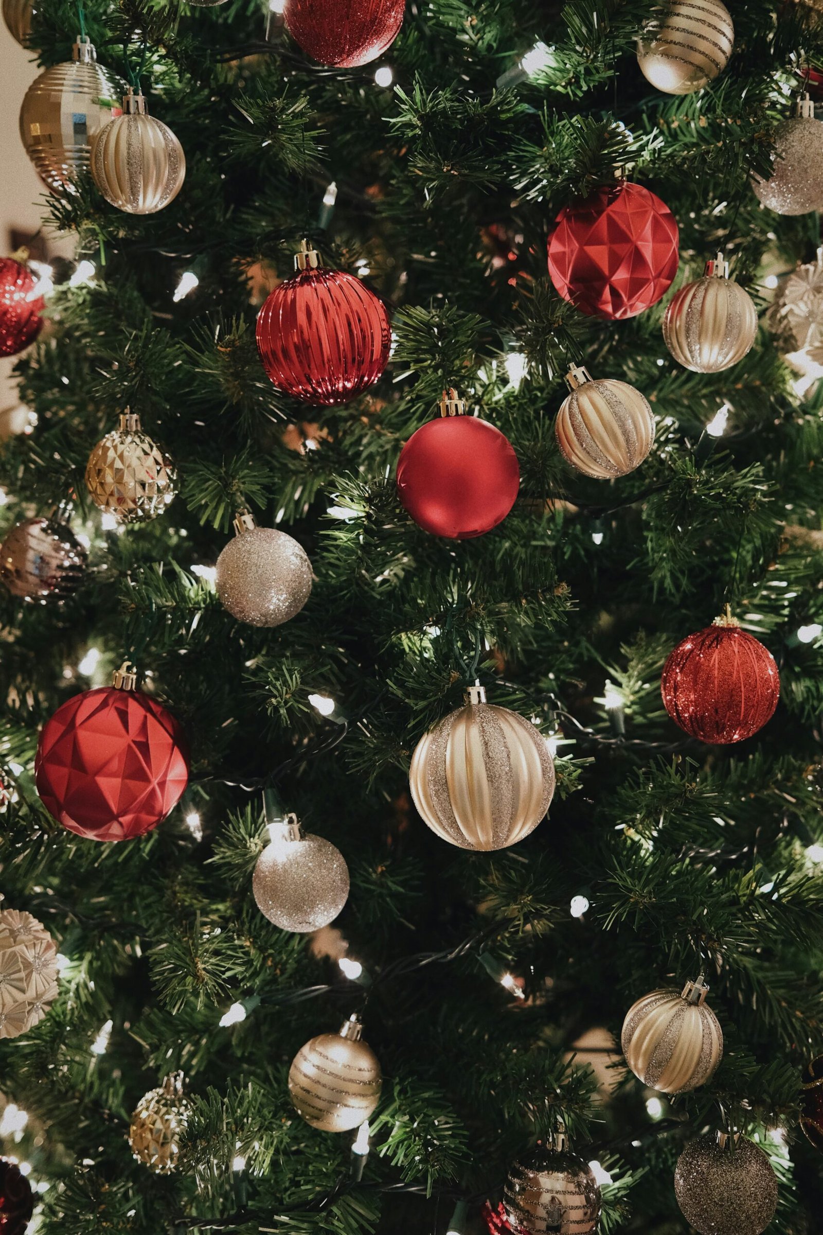 a close up of a christmas tree with ornaments